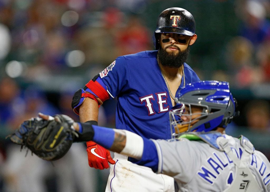 Texas Rangers second baseman Rougned Odor (12) looks back as Kansas City Royals catcher Martin Maldonado (16) throws the ball back after Odor was struck out on the last out of the game at Globe Life Park in Arlington, Texas on Thursday, May 30, 2018. Texas Rangers lost to the Kansas City Royals 4-2. (Vernon Bryant/The Dallas Morning News)