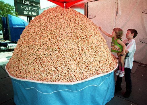 Amanda Adams got a little help from her  big brother Kyle Adams to place some popcorn onto...