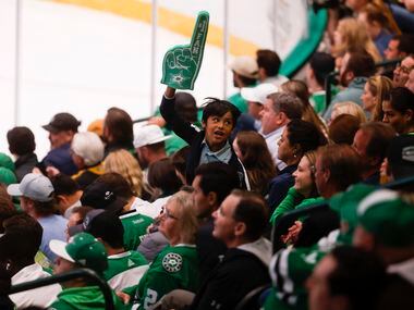 A Dallas Stars fan cheers during the second period of a game against the Arizona Coyotes, on...