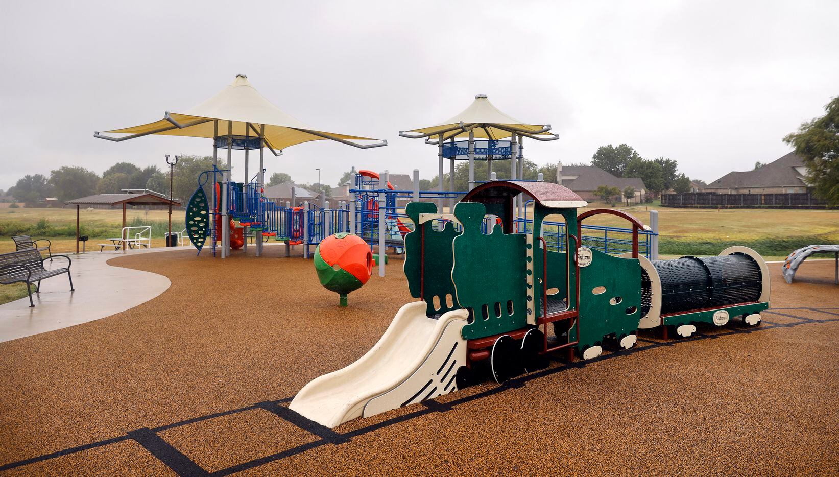 Children’s play equipment is modeled after a train in the Willow Creek Station park in Saginaw.