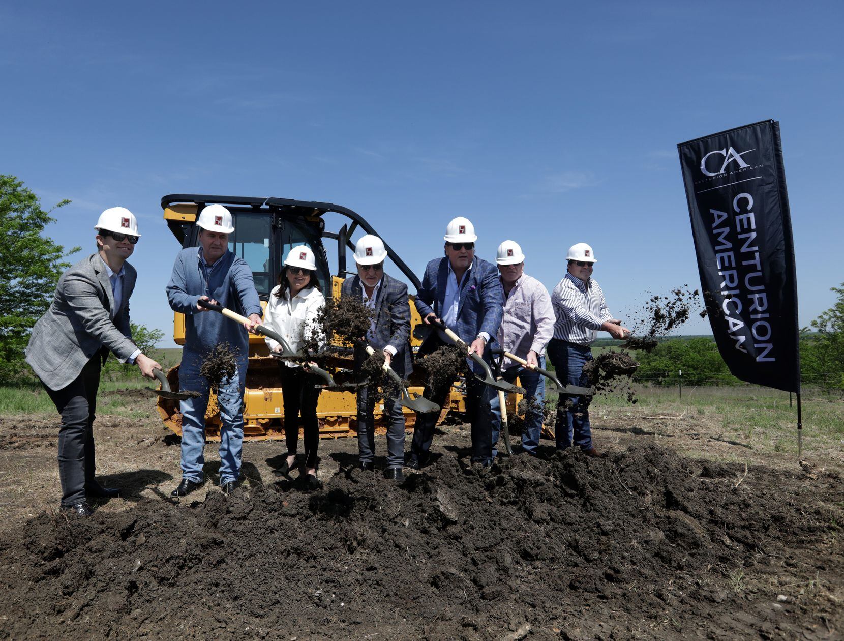 VIPs participate in a ceremonial groundbreaking at the new Centurion American development in...