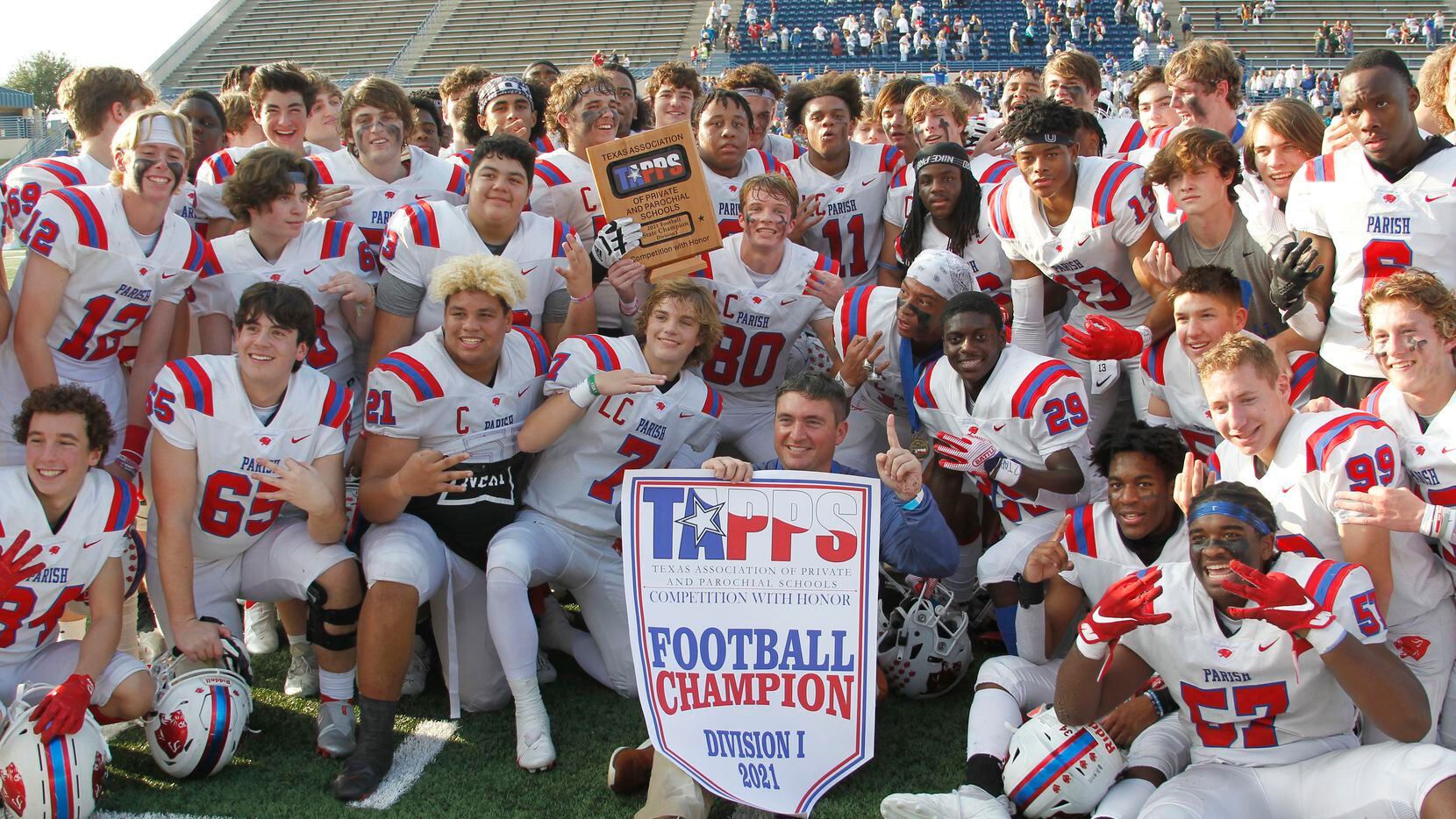 Parish Episcopal head coach Daniel Novakov poses with members of his team following their 56-17 victory over Midland Cghristian to capture the TAPPS state Division 1 trophy and title. The two teams played their TAPPS Division 1 state championship football game at Waco ISD Stadium in Waco on December 4, 2021. (Steve Hamm/ Special Contributor)