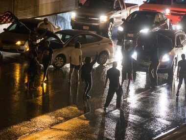 Protesters block traffic during a protest that started at the Jack Evans Police Headquarters...