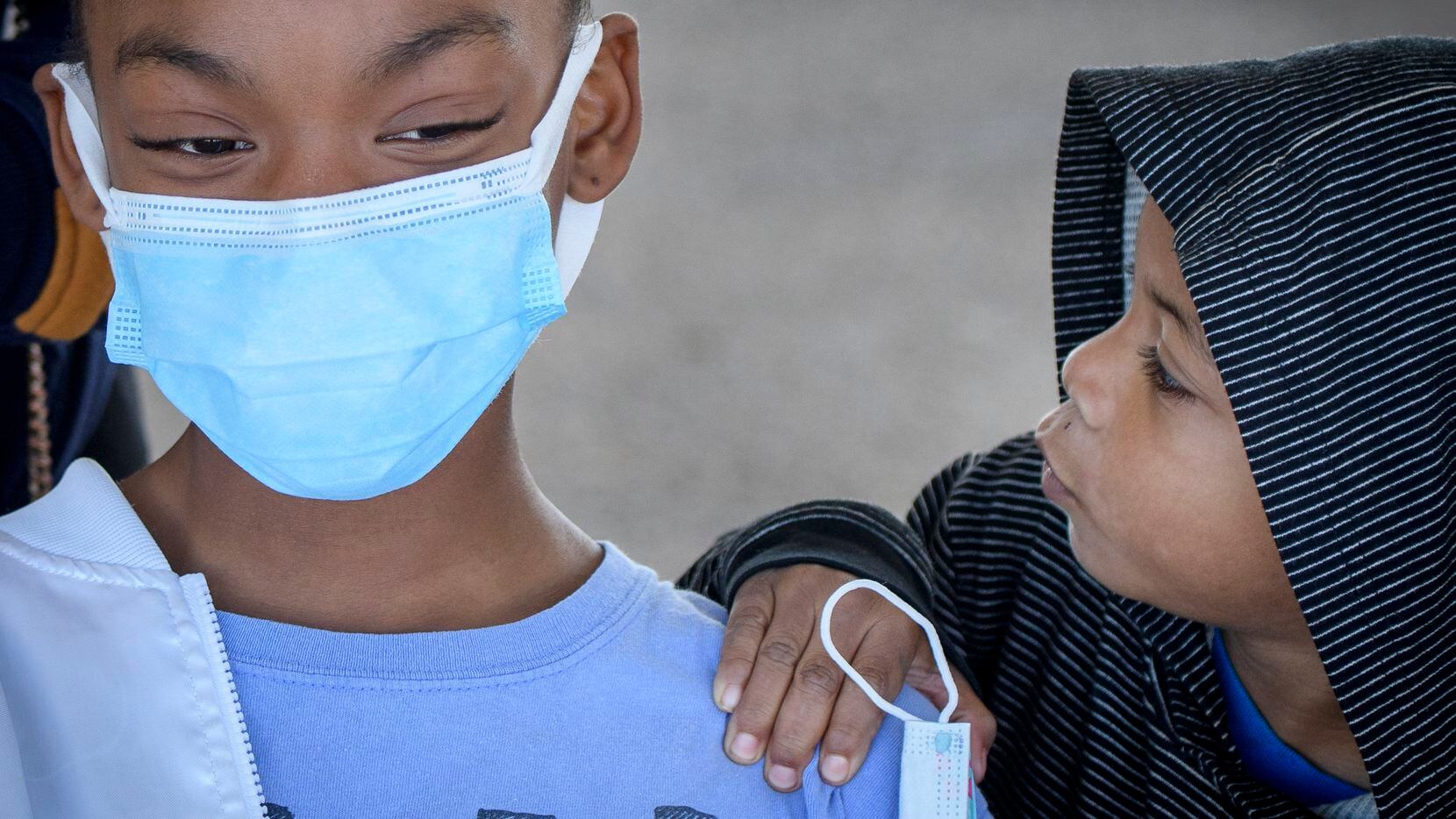 Ten-year-old Kaya Rougeau (cq) gets encouragement from her little brother Kyrie Rogeau prior to getting  her COVID vaccination at the drive-up site outside the Wilkerson-Greines Activity Center in Fort Worth, Texas on November 4, 2021. (Robert W. Hart/Special Contributor)