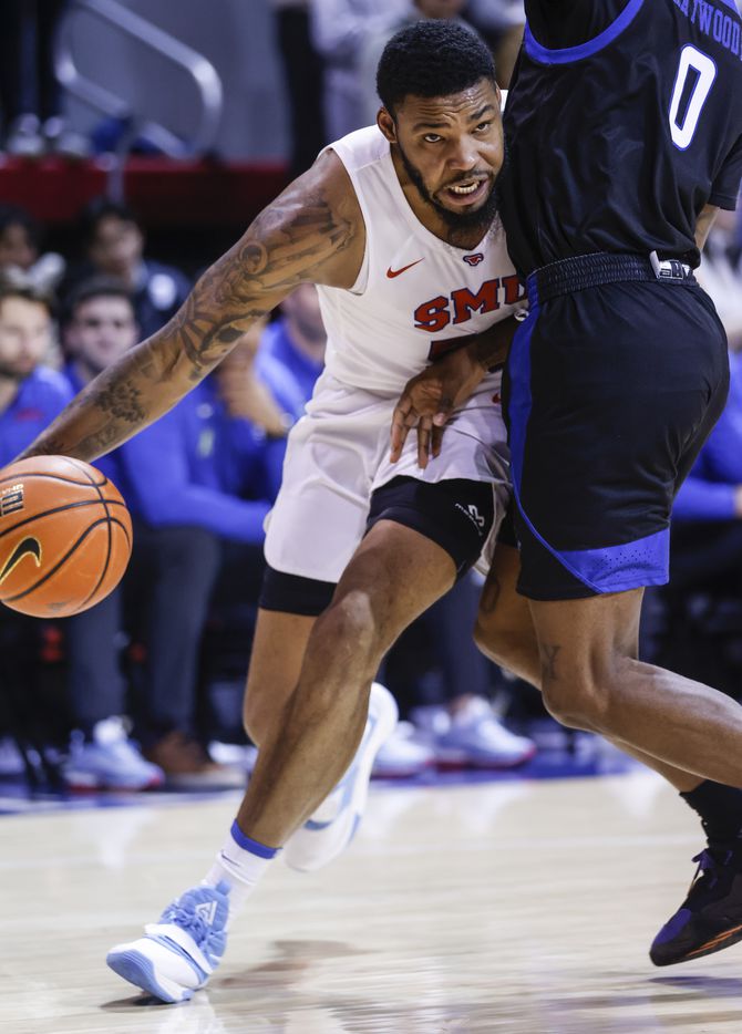 Southern Methodist Mustangs forward Marcus Weathers (50) dribbles the ball towards the net...