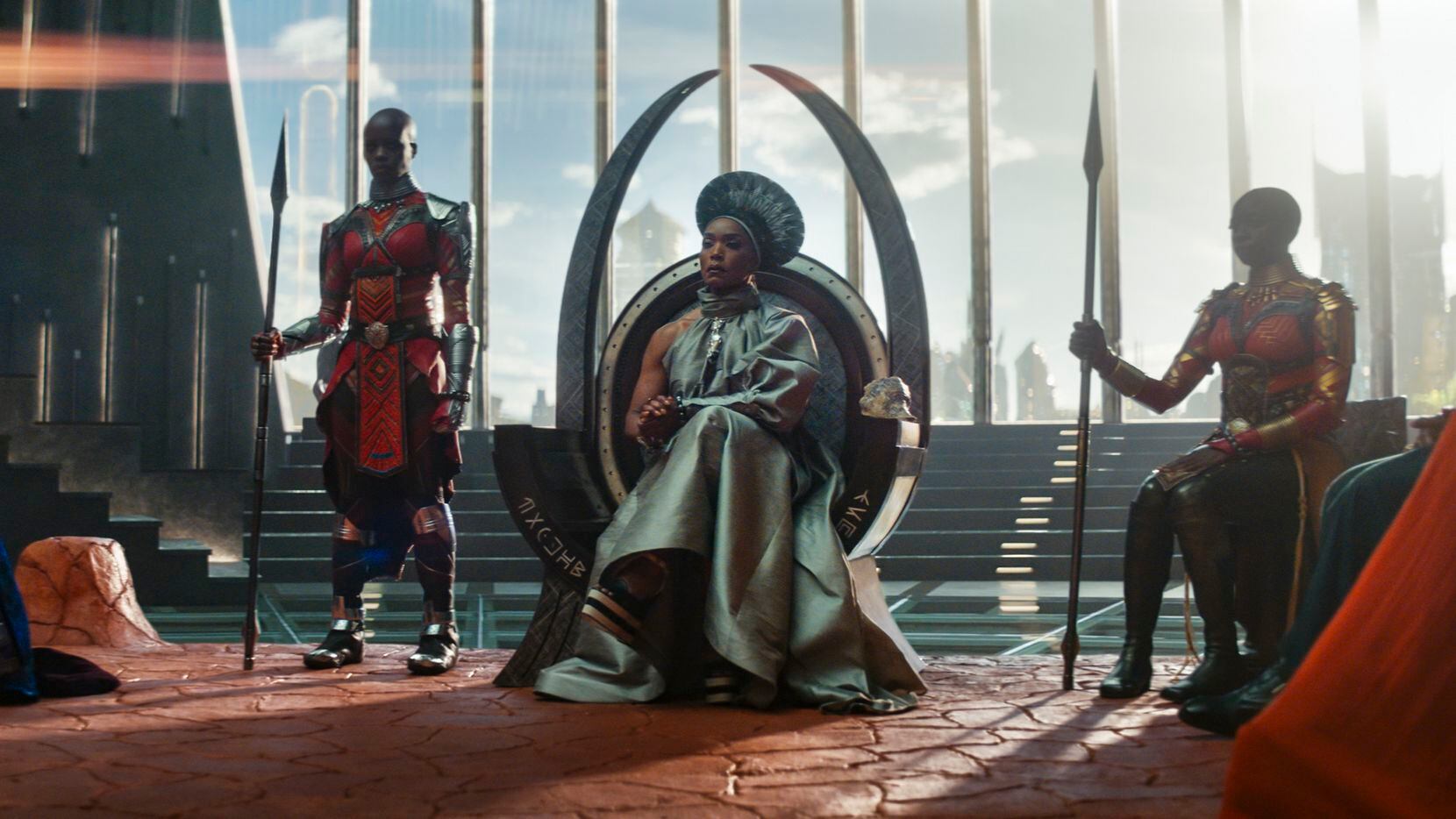 Angela Bassett (center) plays Queen Ramonda in "Black Panther: Wakanda Forever." The film...