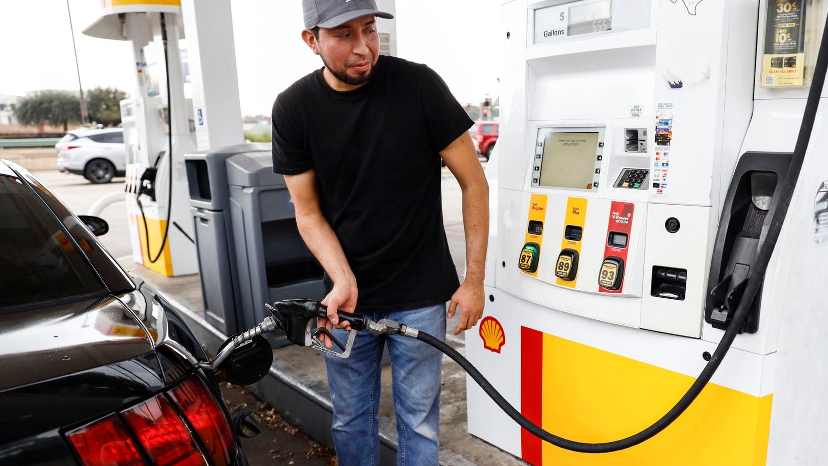 Arturo Hernandez pumps gasoline into his car at Shell on 4611 N US 75-Central Expy 1000 in...