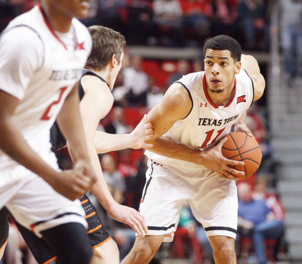 Texas Tech forward Zach Smith looks for an open teammate during the first half of an NCAA...
