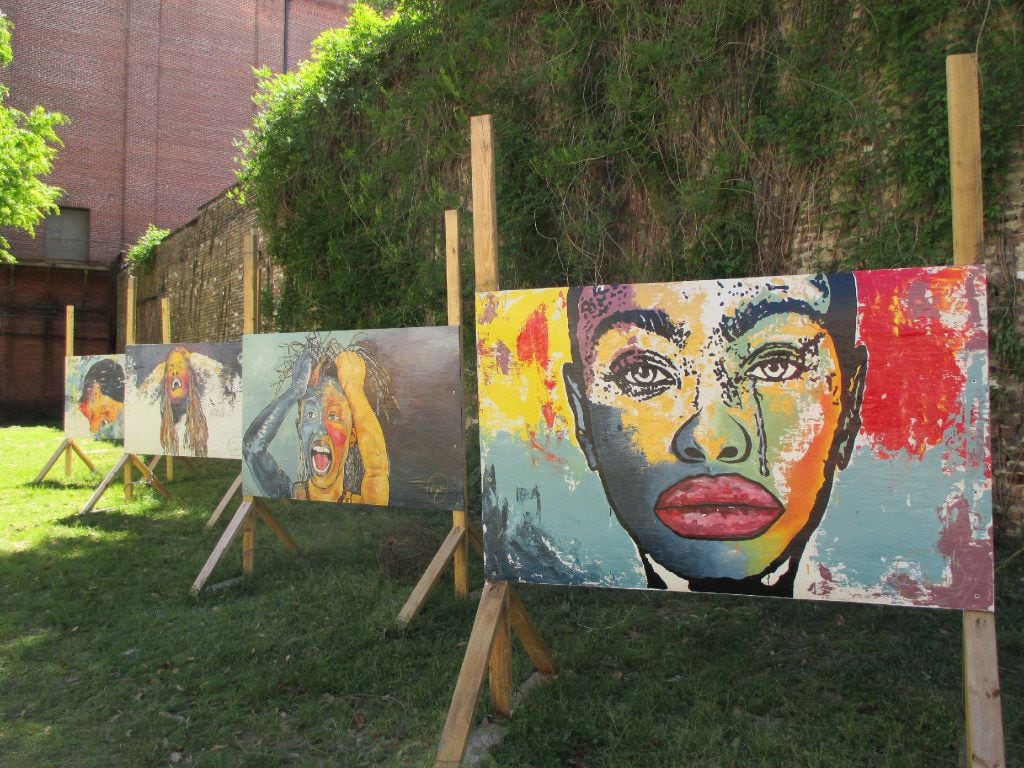 Paintings by locally based artists are displayed in the Lost Garden on Dauphin Street in...
