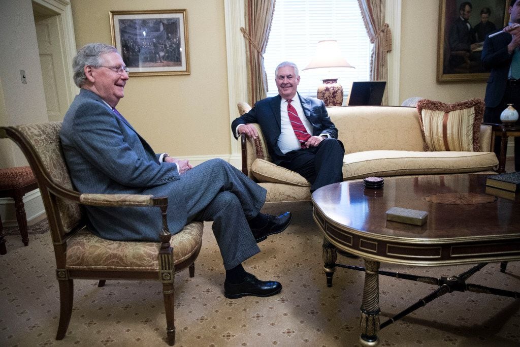 Former Exxon Mobil CEO Rex Tillerson (right, with Senate Majority Leader Mitch McConnell)...