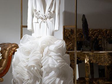 A luxury wedding dress hangs in the entry of Esé Azénabor in the Design District.