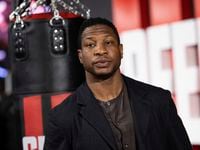 Jonathan Majors poses for photographers upon arrival for the premiere of the film Creed III...