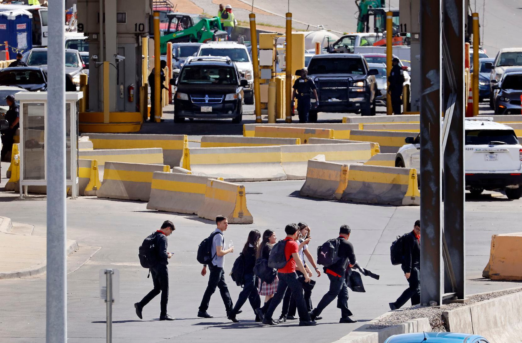 Following classes, school children in El Paso. Texas cut through traffic arriving from...