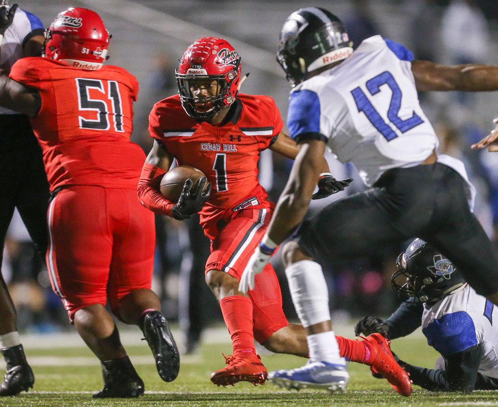 Cedar Hill wide receiver Quin Bright (1) carries the ball past Mansfield Summit linebacker...