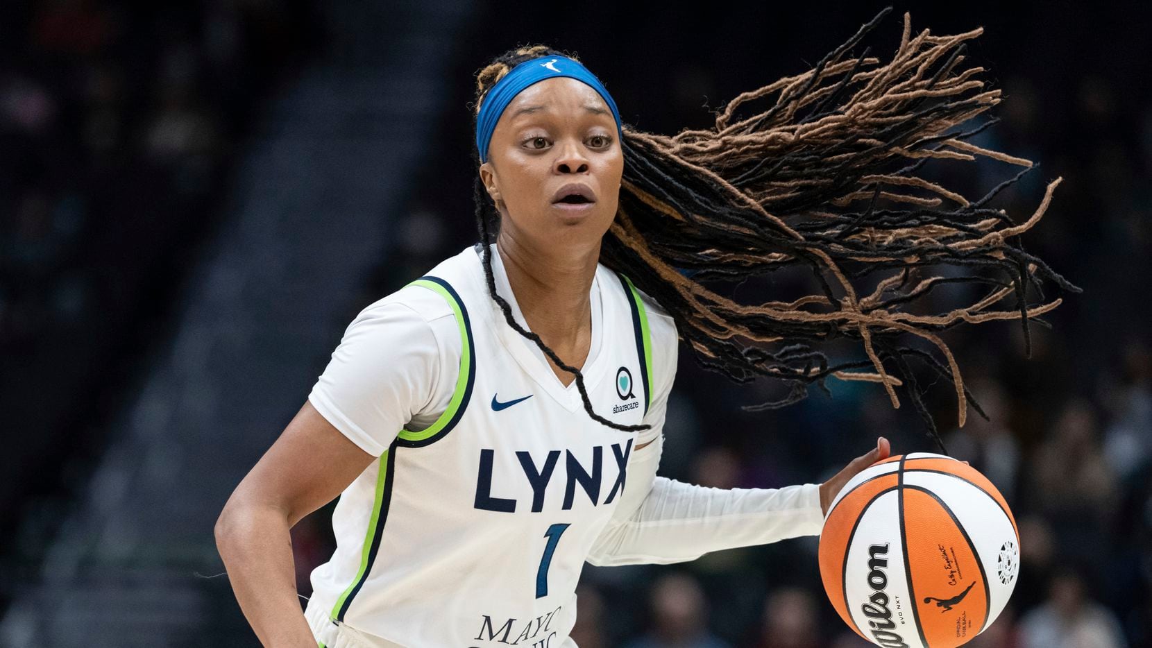 Minnesota Lynx guard Odyssey Sims dribbles the ball during a WNBA basketball game against...