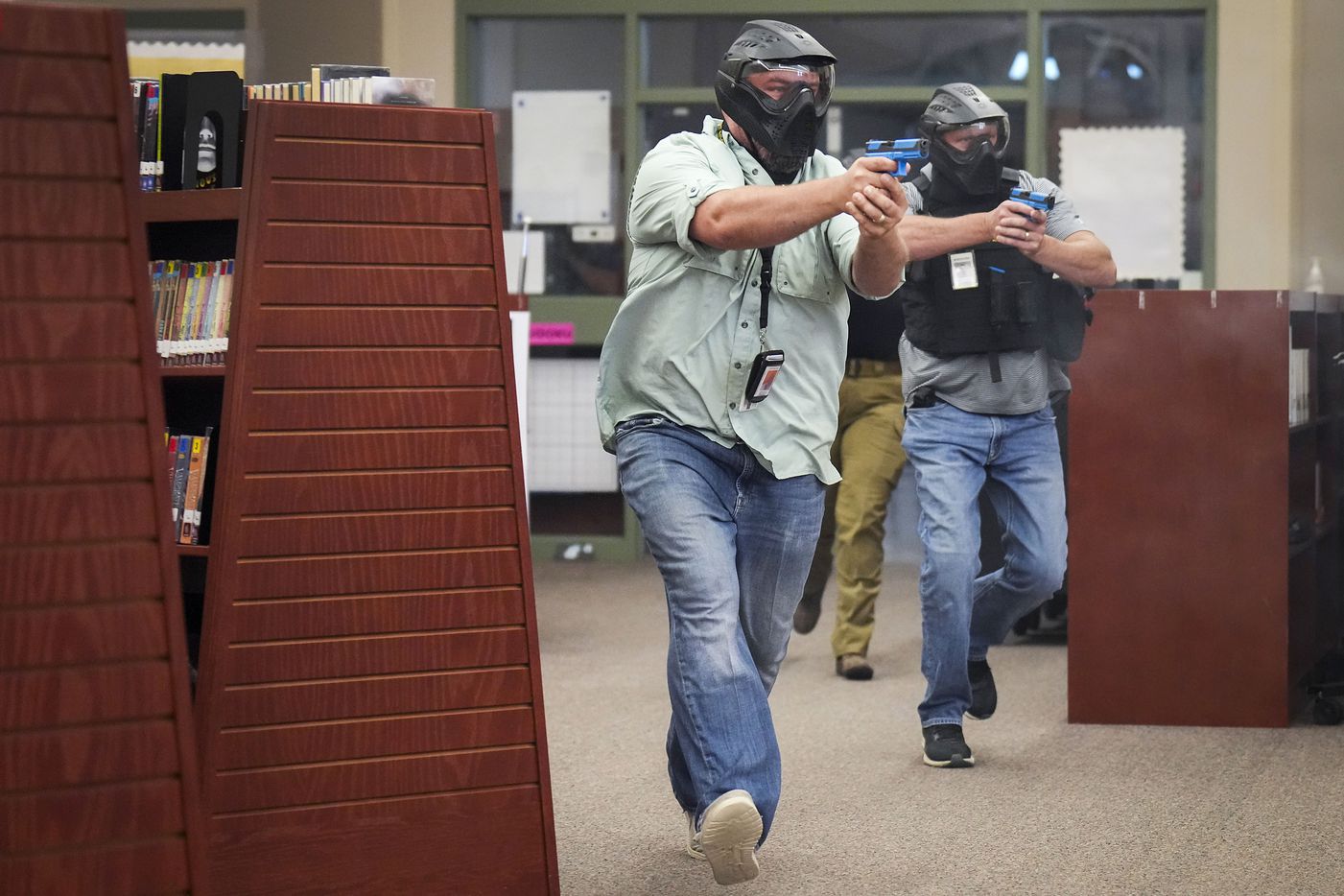 Two school marshals participate in a school safety active shooter training demonstration...