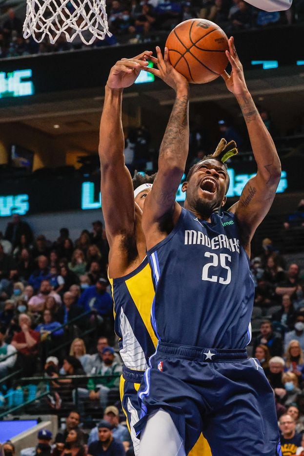 Dallas Mavericks forward Reggie Bullock (25) goes for a shot as Indiana Pacers guard Terry Taylor (32) tries to block him during a game at the American Airlines Center in Dallas on Saturday, January 29, 2022.