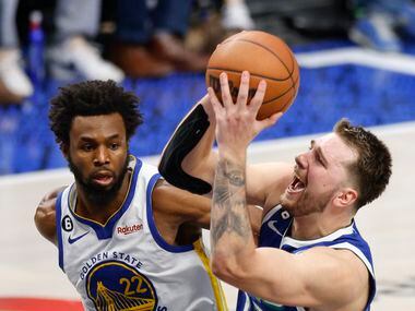 Dallas Mavericks guard Luka Doncic (77) drives to the rim against Golden State Warriors...