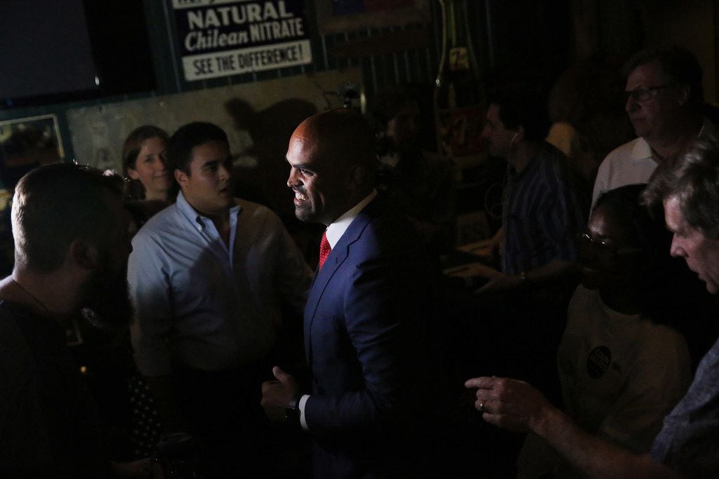 Colin Allred greets supporters after speaking during an election night party.