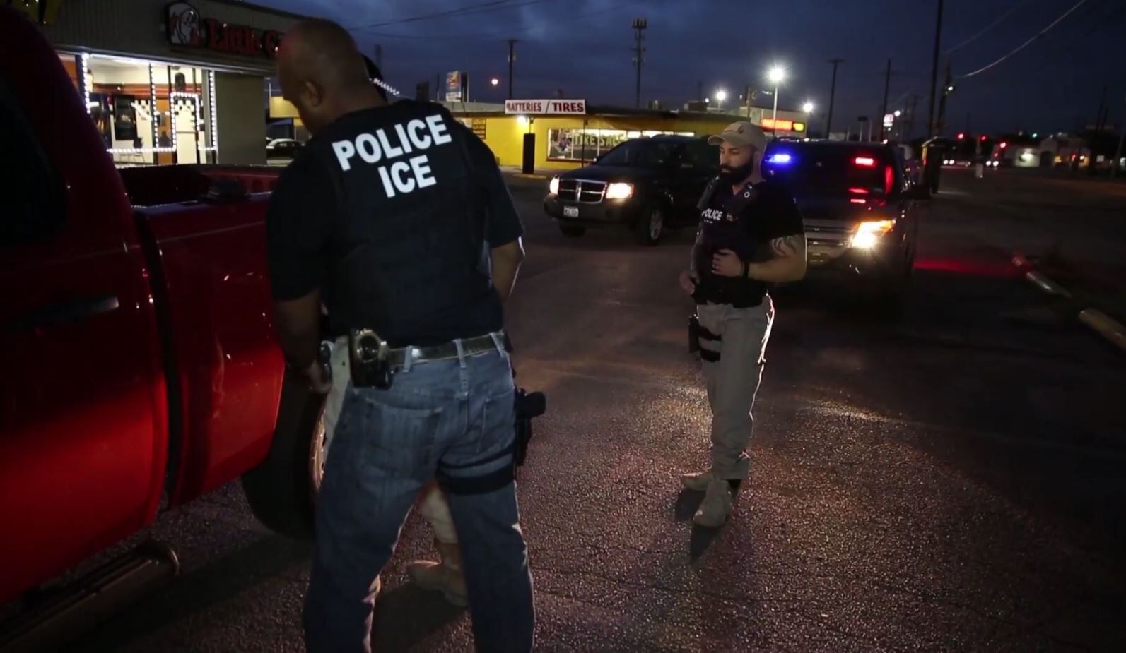 Federal immigration agents arrest a man April 1 in Dallas.