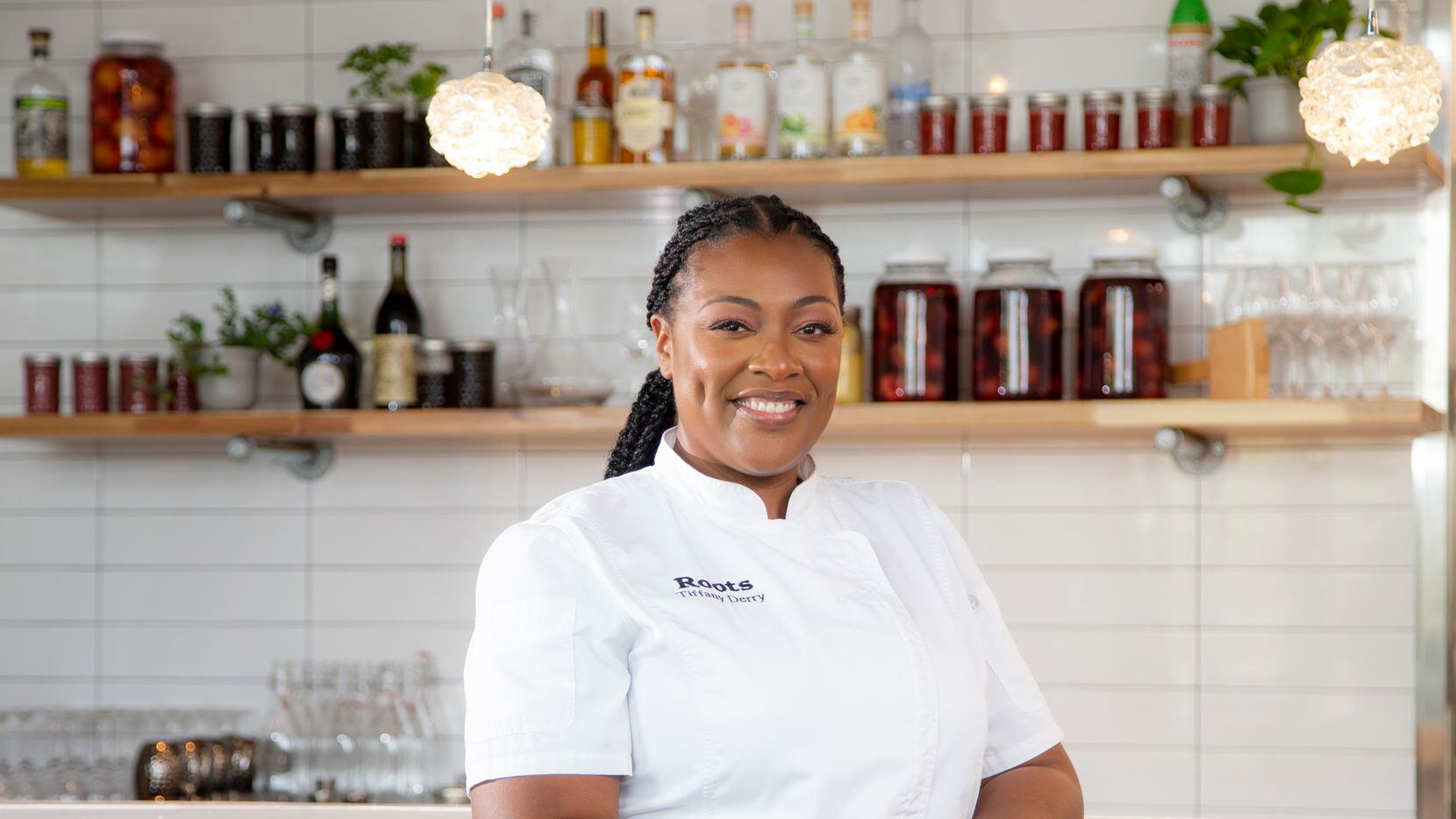 Chef-Owner Tiffany Derry poses for a photo at her restaurant, Roots Southern Kitchen, in...
