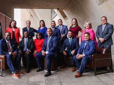 Recently elected Dallas City Council members pose together with Mayor Eric Johnson at the...