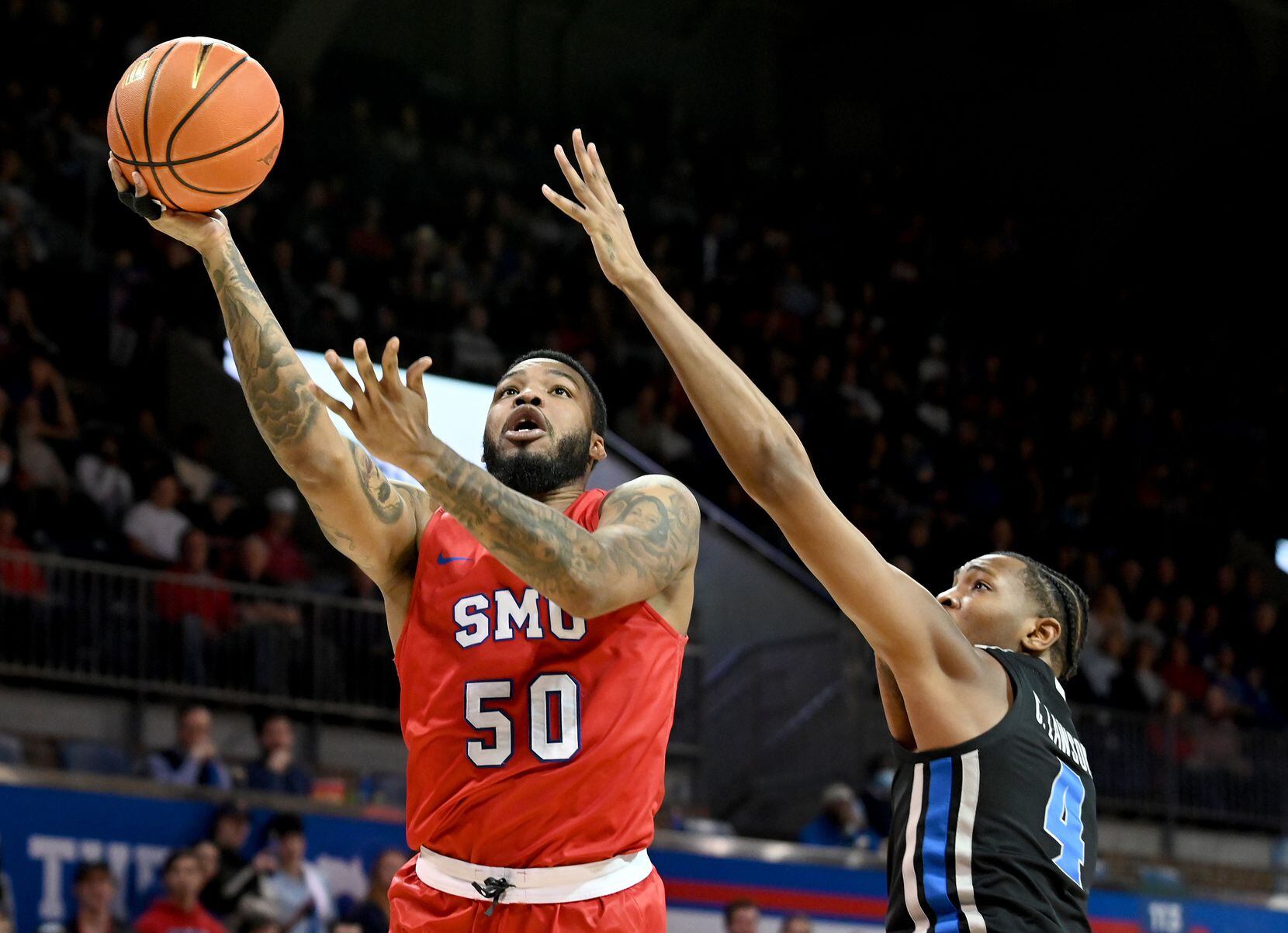 SMU forward Marcus Weathers (50) shoots on Memphis forward Chandler Lawson (4) in the second...