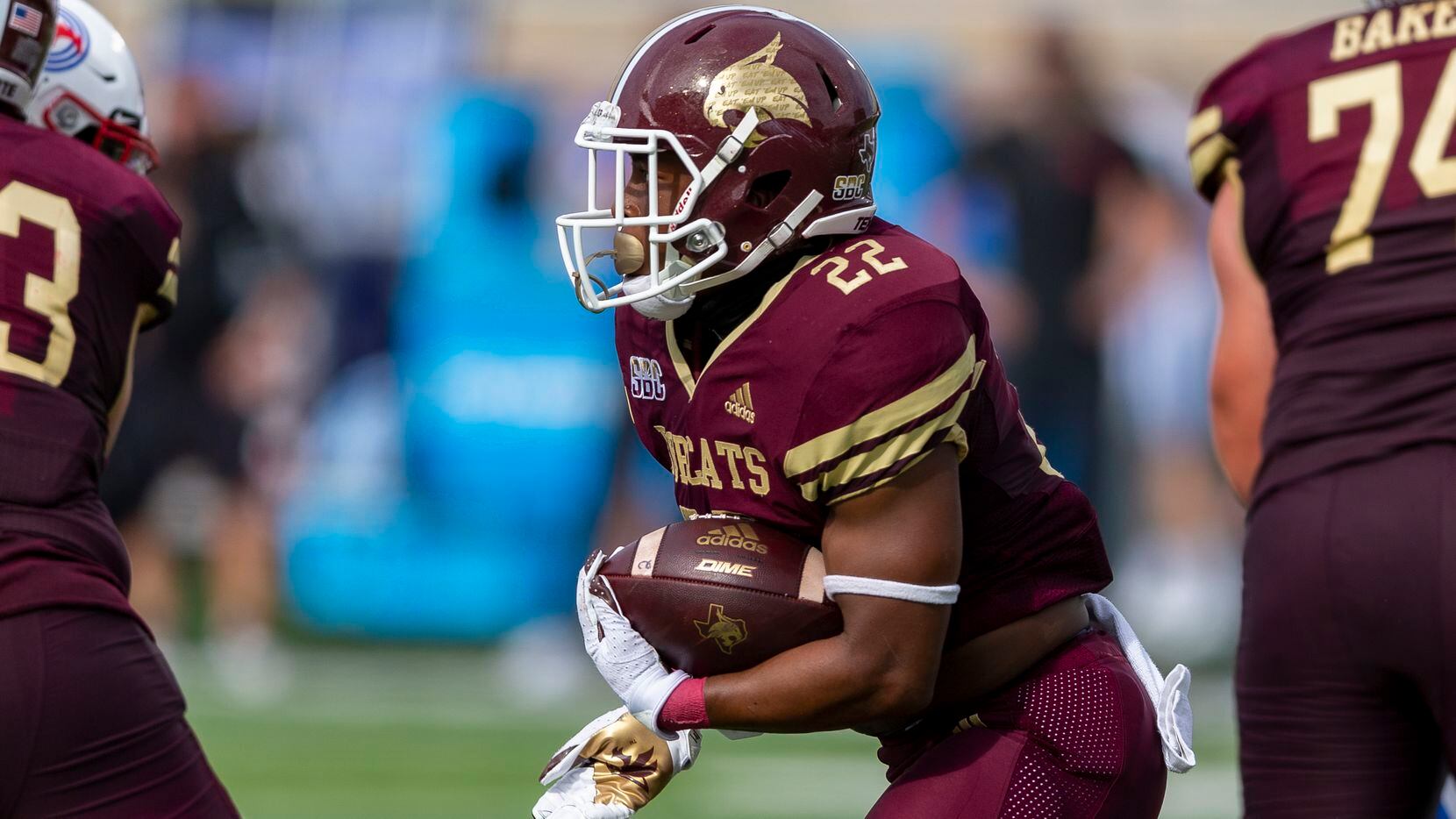 Texas State running back Calvin Hill (22) looks for running room against Southern Methodist...
