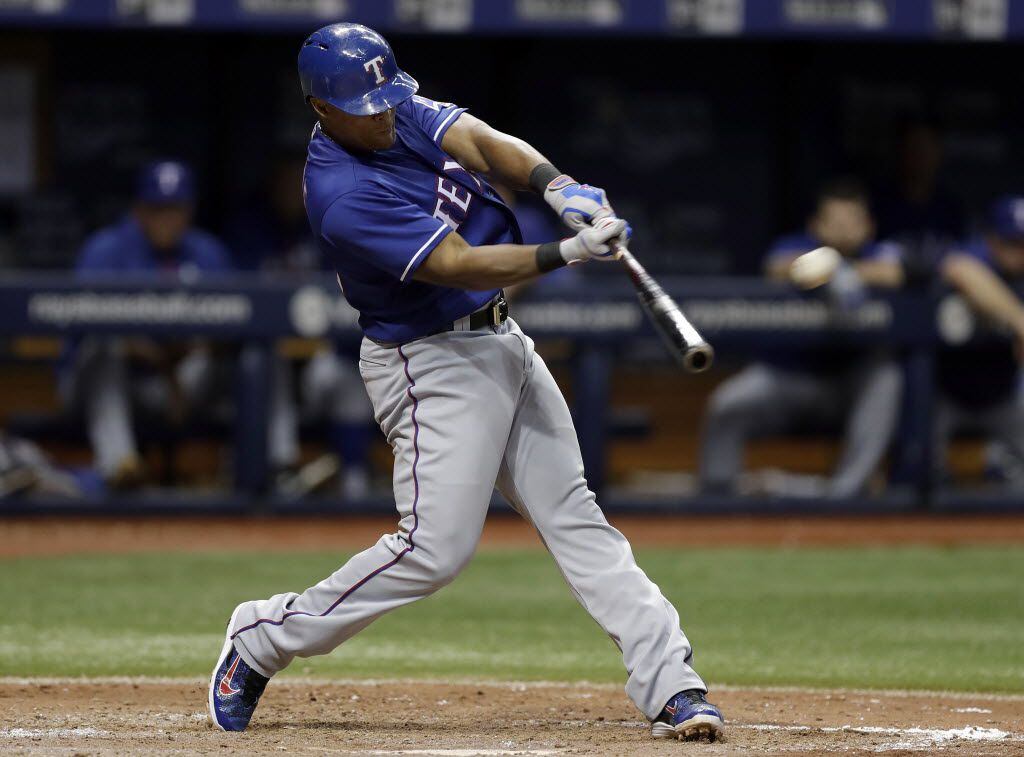 Texas Rangers' Adrian Beltre connects for a home run off Tampa Bay Rays relief pitcher Ryan...