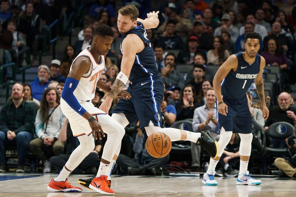 Dallas Mavericks guard Luka Doncic (77) knocks the ball away from New York Knicks guard Frank Ntilikina (11) during the first half of an NBA basketball game at American Airlines Center on Friday, Nov. 8, 2019, in Dallas. (Smiley N. Pool/The Dallas Morning News)