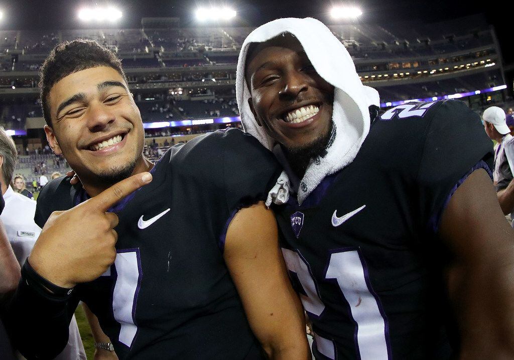 FORT WORTH, TX - OCTOBER 21:  (L-R) Kenny Hill #7 of the TCU Horned Frogs celebrates with Kyle Hicks #21 of the TCU Horned Frogs after the TCU Horned Frogs beat the Kansas Jayhawks 43-0 at Amon G. Carter Stadium on October 21, 2017 in Fort Worth, Texas.  (Photo by Tom Pennington/Getty Images)