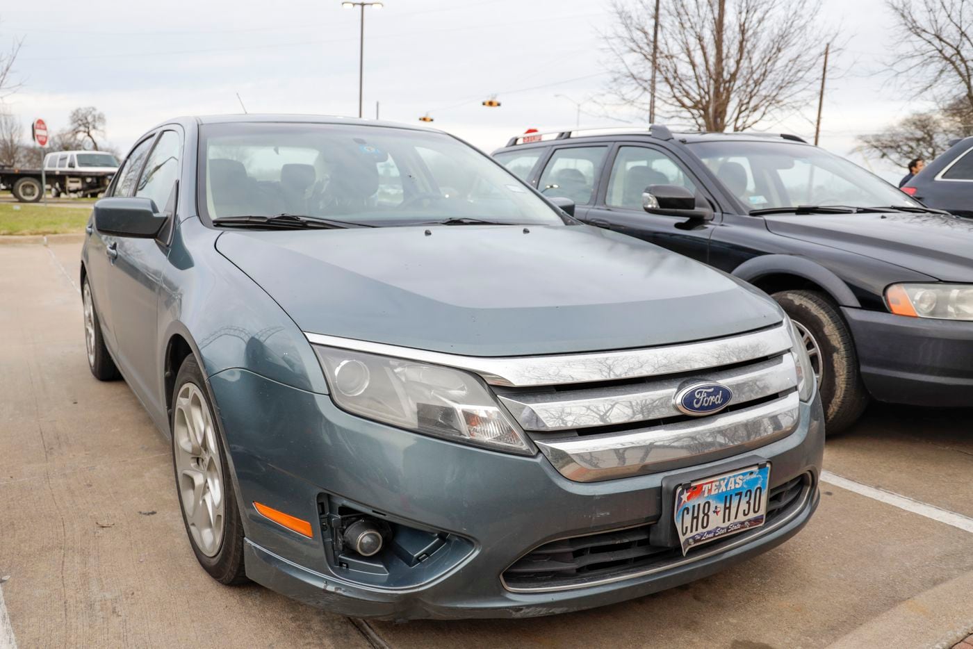 A blue Ford Fusion registered to Dallas City Council member Kevin Felder's address is parked...