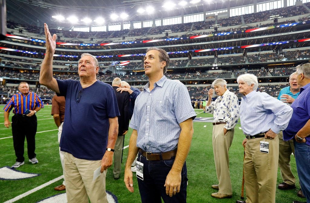 Michael Meredith, left, son of Cowboys great Don Meredith, and former Cowboys quarterback Craig Morton look at the Ring Of Honor following the 1960's player introductions before the game with the Los Angeles Rams, Sunday, October 1, 2017. 