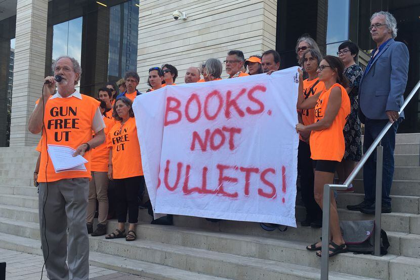 Professors and students from the University of Texas stood outside the U.S. District Court...
