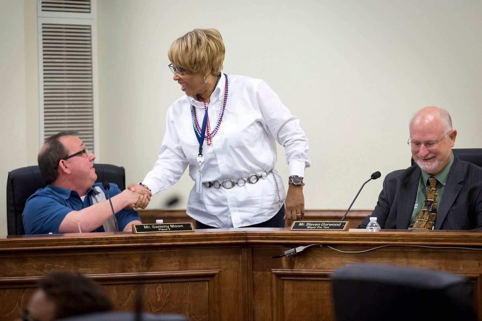 Balch Springs City Council member Wanda Adams greeted colleague Sammy Moon as Mayor Pro Tem...