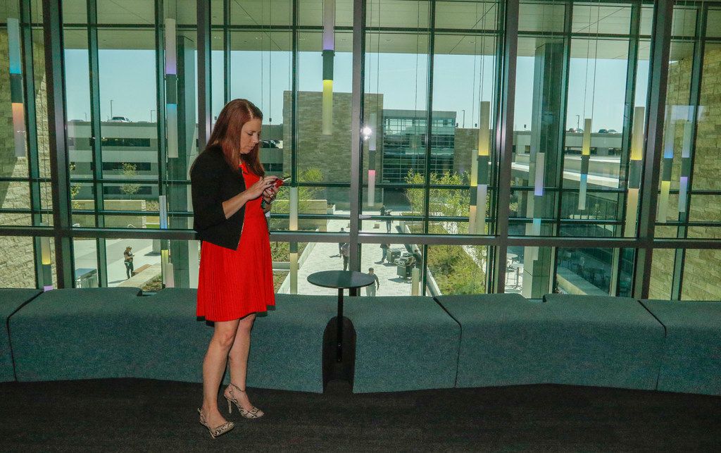 TD Ameritrade employee Shasta Phillips, checks her email at new 318,000-square-foot...