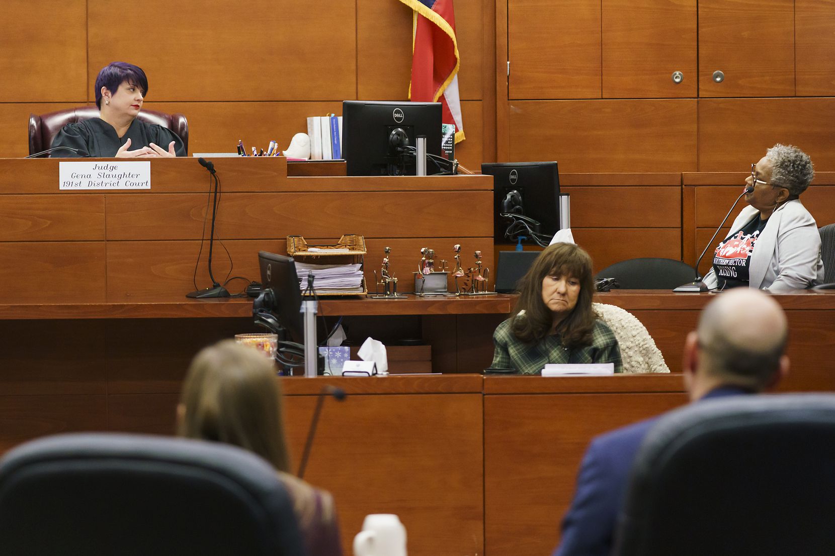 Marsha Jackson, right, is questioned by state District Judge Gena Slaughter, left, during a...