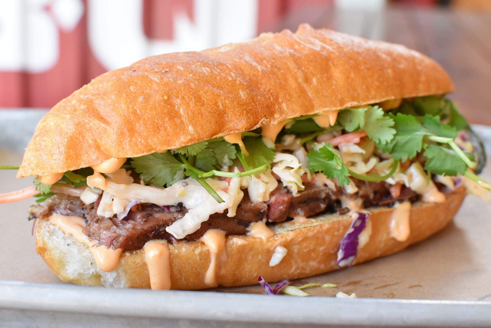 Some of the sandwiches at Brisket Love BBQ don't look like traditional Central Texas barbecue. The brisket banh mi comes on a hoagie, with cilantro and barbecue mayo. 