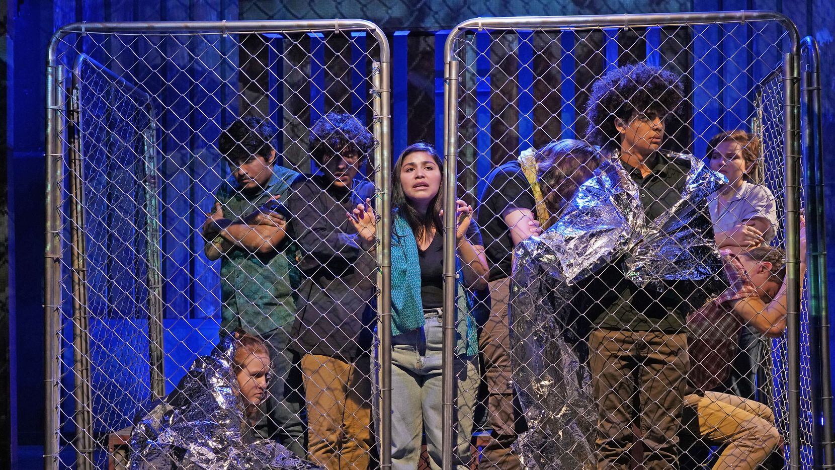 Teen actors from Cry Havoc Theater Company depict immigrants being held at the border in...