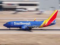 A Southwest Airlines plane is about to take off at Dallas Love Field airport in Dallas on...