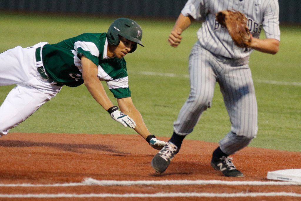 Prosper's Jaden Ford,  #22 .makes a safe dive back to first against  McKinney North boys baseball at Prosper on Tuesday April 4, 2017. (Ron Baselice/The Dallas Morning News)
