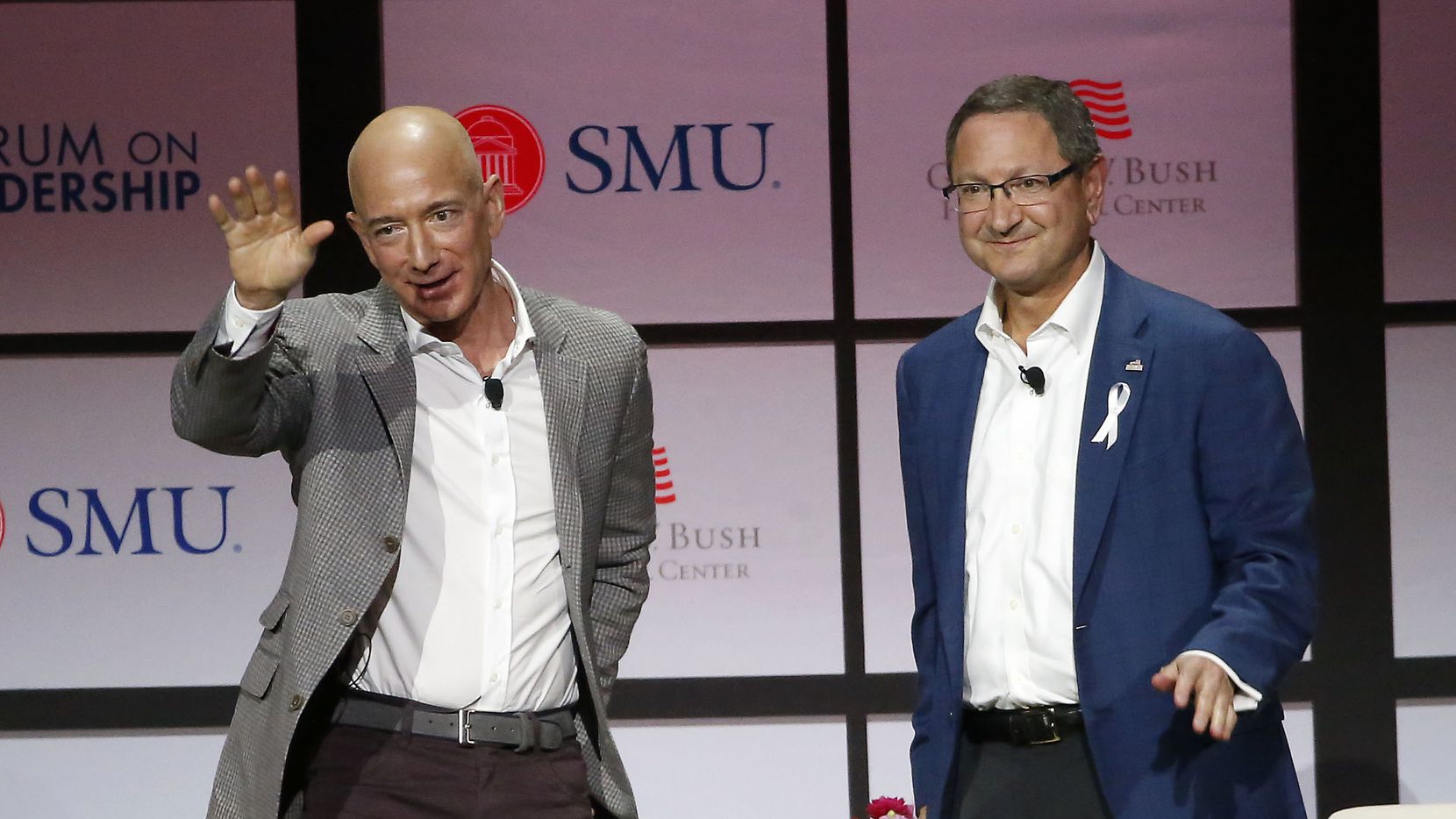 Jeff Bezos waved to the crowd before speaking with Ken Hersh, president and chief executive of the George W. Bush Presidential Center, at a 2018 leadership forum hosted in Dallas by the Bush Center.