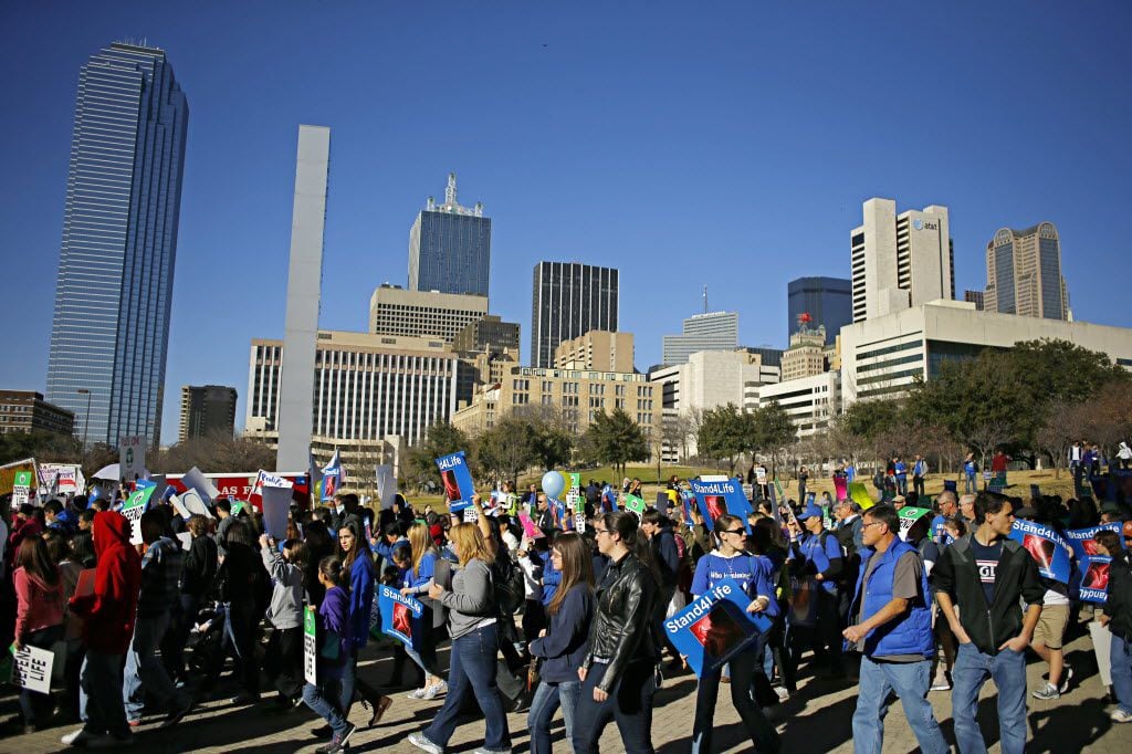 Protesters marched past the Dallas Convention Center during the Dallas March for Life &...