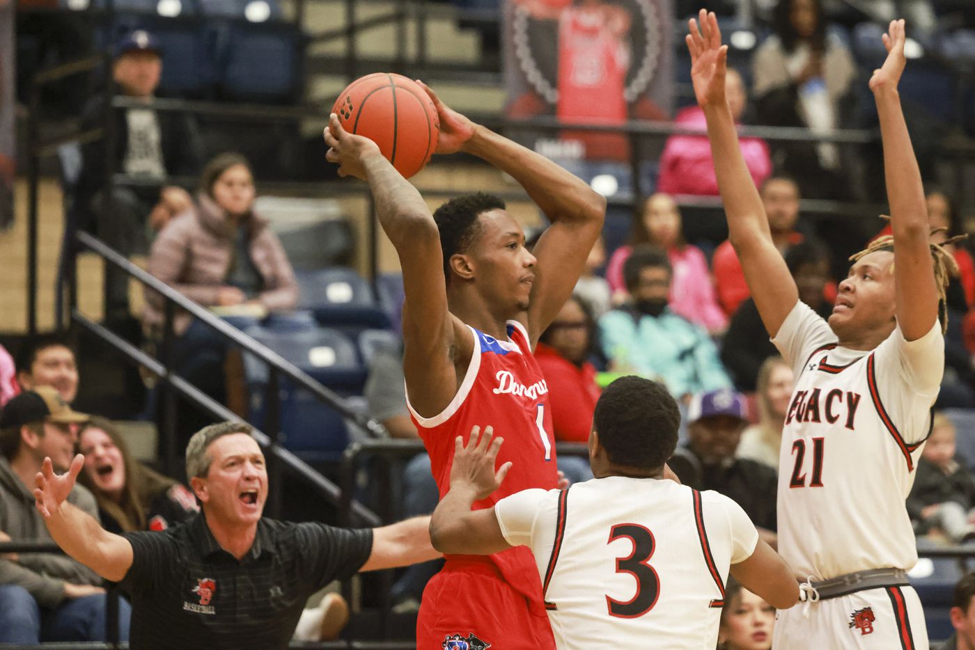 Duncanville High School’s Ron Holland (1) is defended by Mansfield Legacy High School’s...