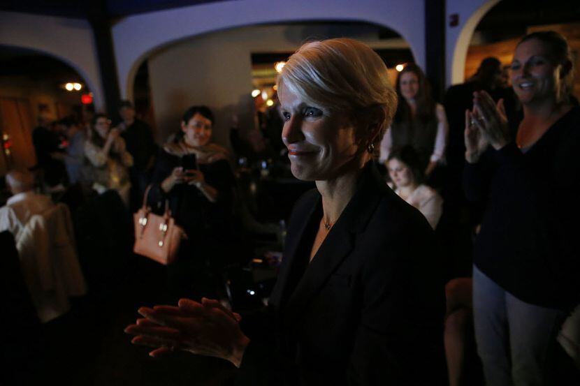 Susan Hawk celebrates with supporters after winning her race against current Dallas County...