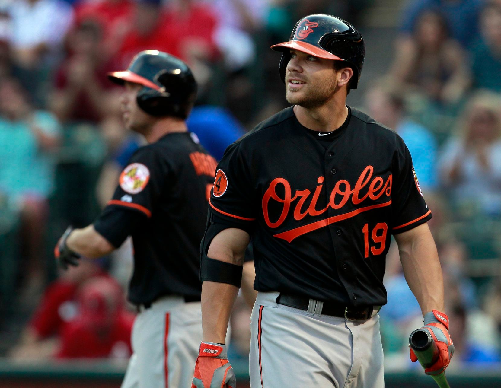 Baltimore Orioles first baseman Chris Davis (19) reacts after striking out against Texas...