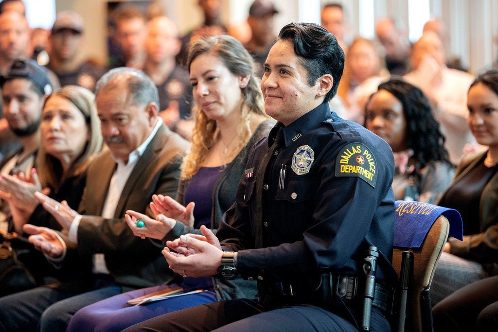 Dallas police officer Crystal Almeida claps after hearing Chief U. Renee Hall, not pictured, commend her service, before receiving the Theodore Roosevelt Police Award on Thursday, April 11, 2019 at the Jack Evans Police Headquarters in Dallas. 