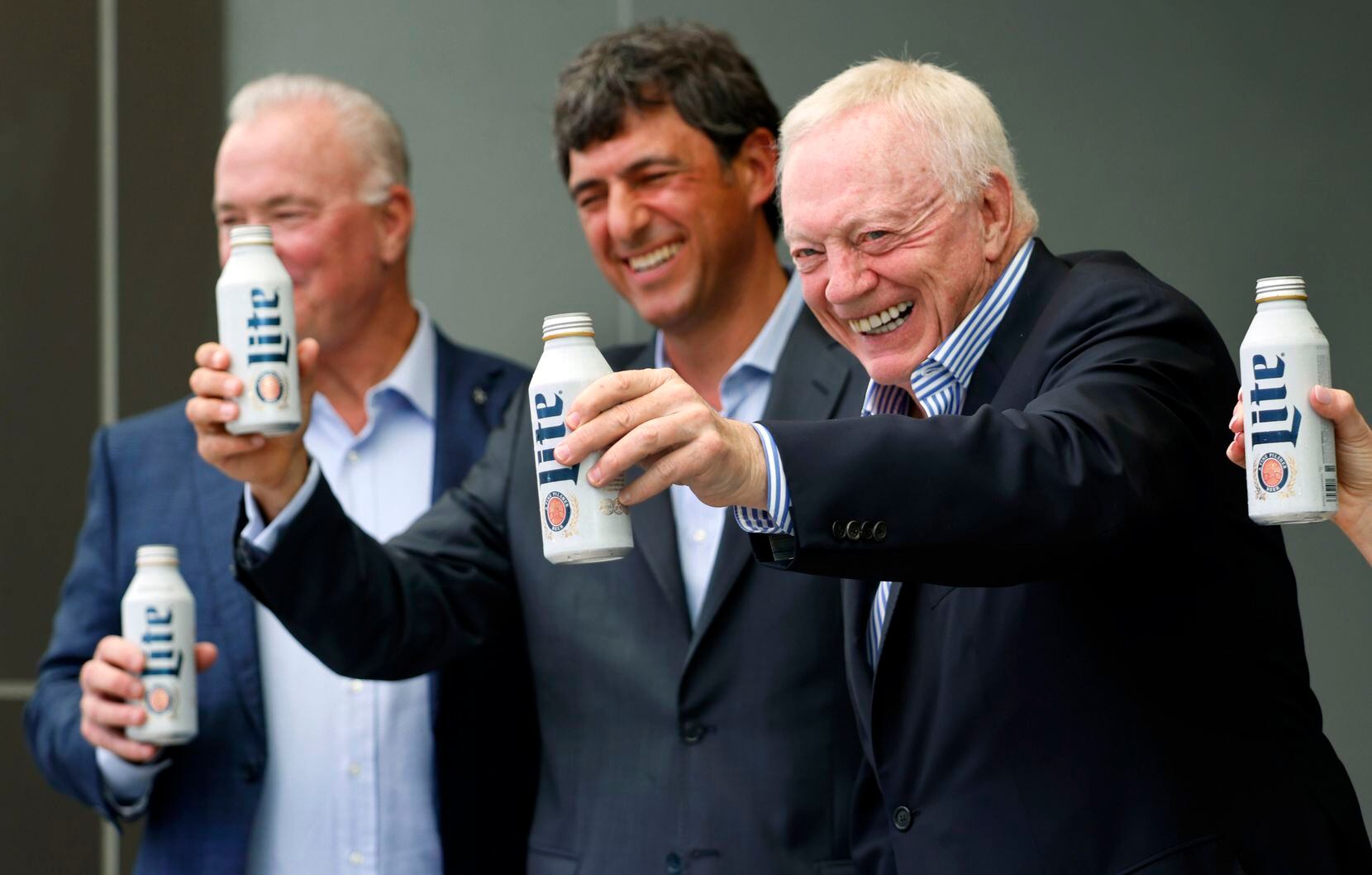 Cowboys owner Jerry Jones (right) raised a Miller Lite with Molson Coors partnerships chief...