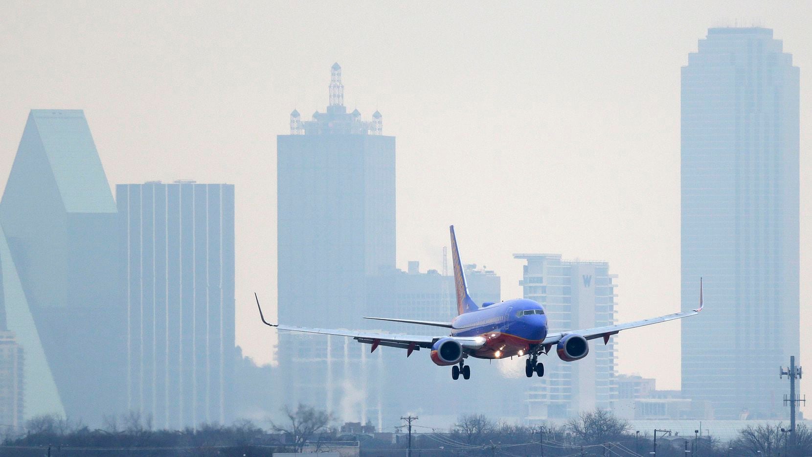 A Southwest Airlines jet plane lines up for a landing at Love Field in Dallas.