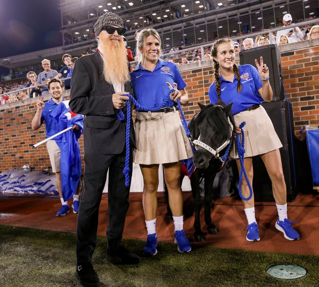 ZZ Top's Billy Gibbons poses for a photo with Peruna during the first quarter of a Southern...